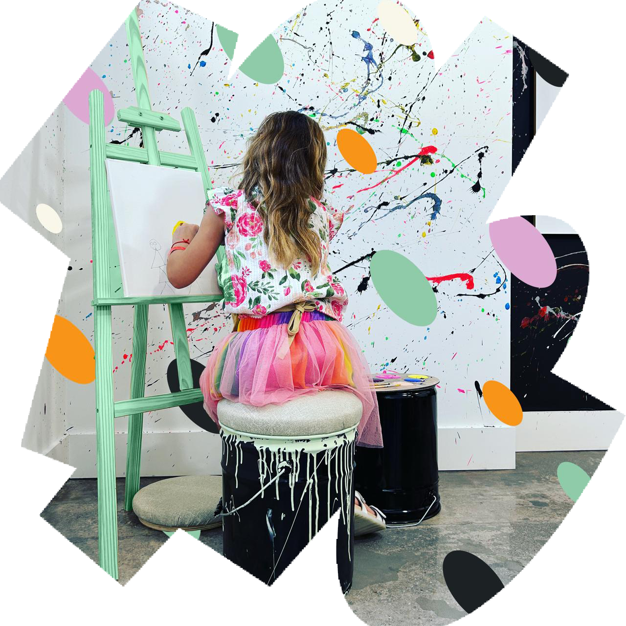 A student painting at an easel